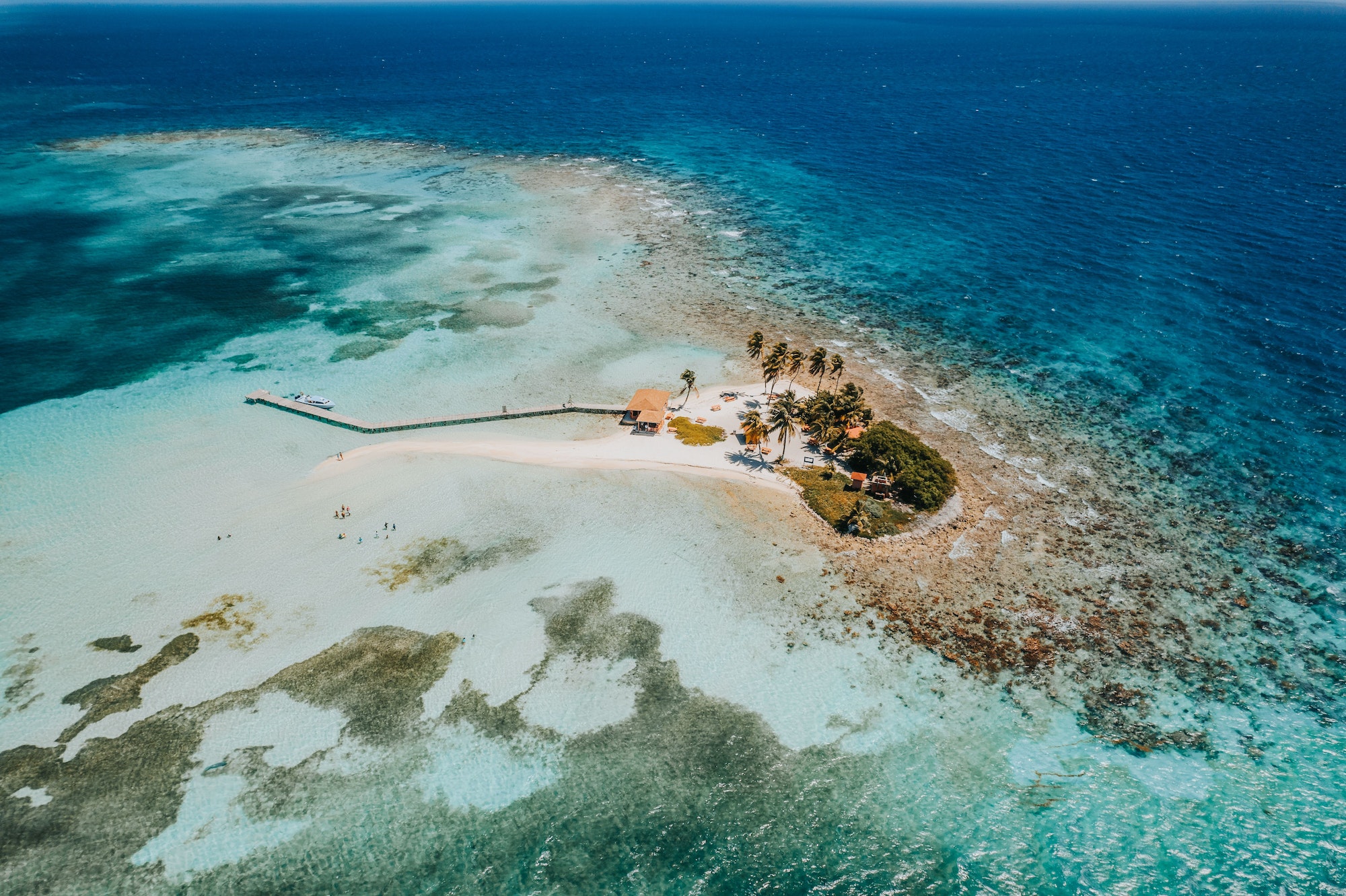 Aerial top view of the Caribbean Sea in the Goff's Caye island in Belize, Central America